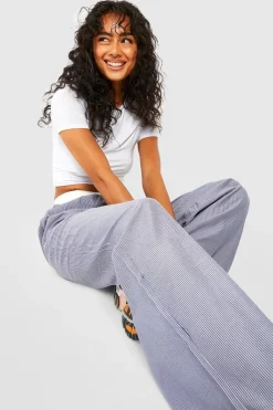 Pantalon rayé à jambe large avec ceinture contrastante