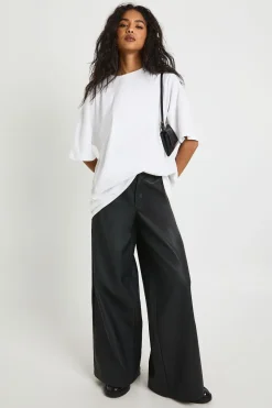 Pantalon synthétique à taille cintrée et jambes larges