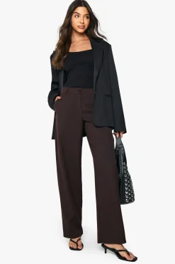 Pantalon taille basse, coupe slim, jambe en forme de tonneau