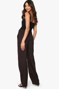 Pantalon taille basse, coupe slim, jambe en forme de tonneau