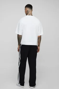 Pantalon taille haute avec élastique, coupe décontractée et panneau latéral.