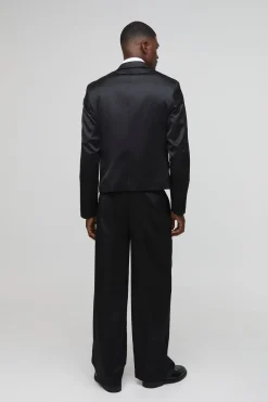Pantalon tailleur en satin à jambe large avec pli à l'avant