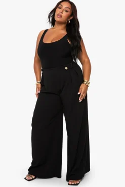 Pantalon tailleur à jambe large, taille élastiquée et garniture dorée