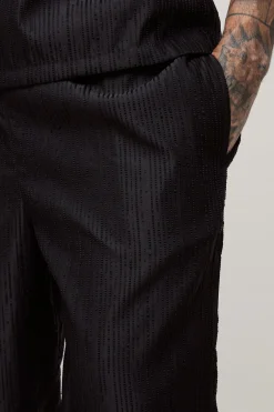boohooMAN Pantalon à texture côtelée tissée, ourlet fendu, coupe décontractée<Homme Pantalons Tall|Tout Afficher