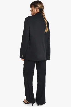 Pantalon tissé sur mesure à jambe large et ourlet effiloché