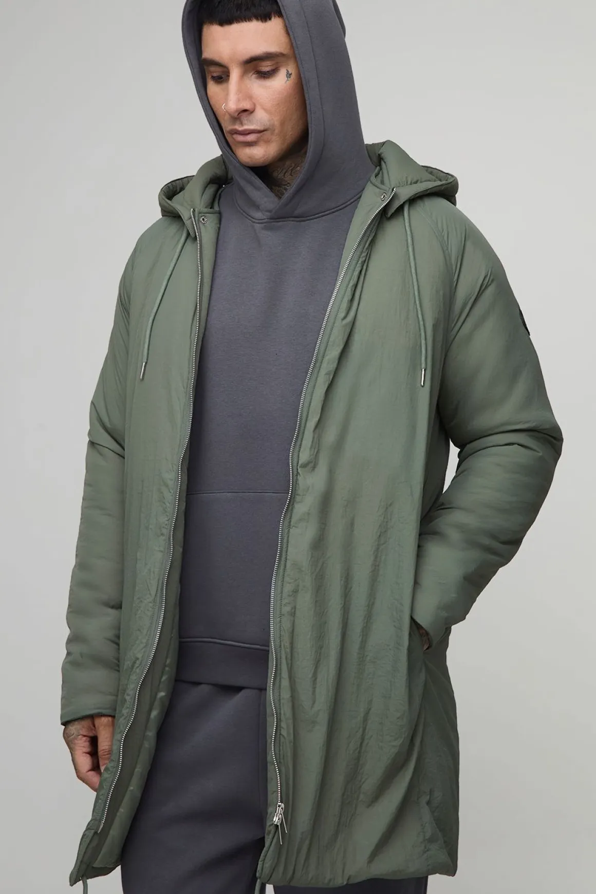 Parka à capuche longue, zippée et rembourrée