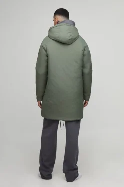 Parka à capuche longue, zippée et rembourrée