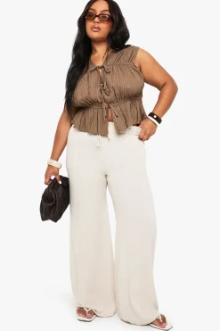 Peplum grande taille à nouer sur le devant en lin rayé