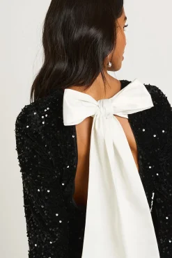 Petite robe mini en velours à sequins avec nœud au dos