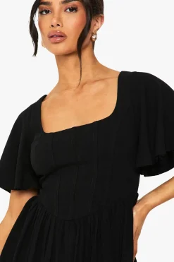 Petite robe patineuse en mélange de lin, corset, manches d'ange