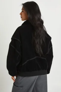 Petite veste bomber en suédé synthétique à surpiqûres contrastées