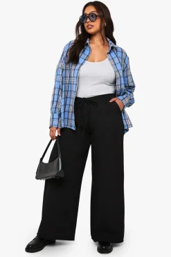 Plus pantalon à jambe large en tissu tissé et élastiqué avec ceinture nouable à l'arrière