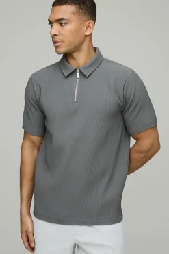 Polo à col zippé, manches courtes plissées, coupe régulière