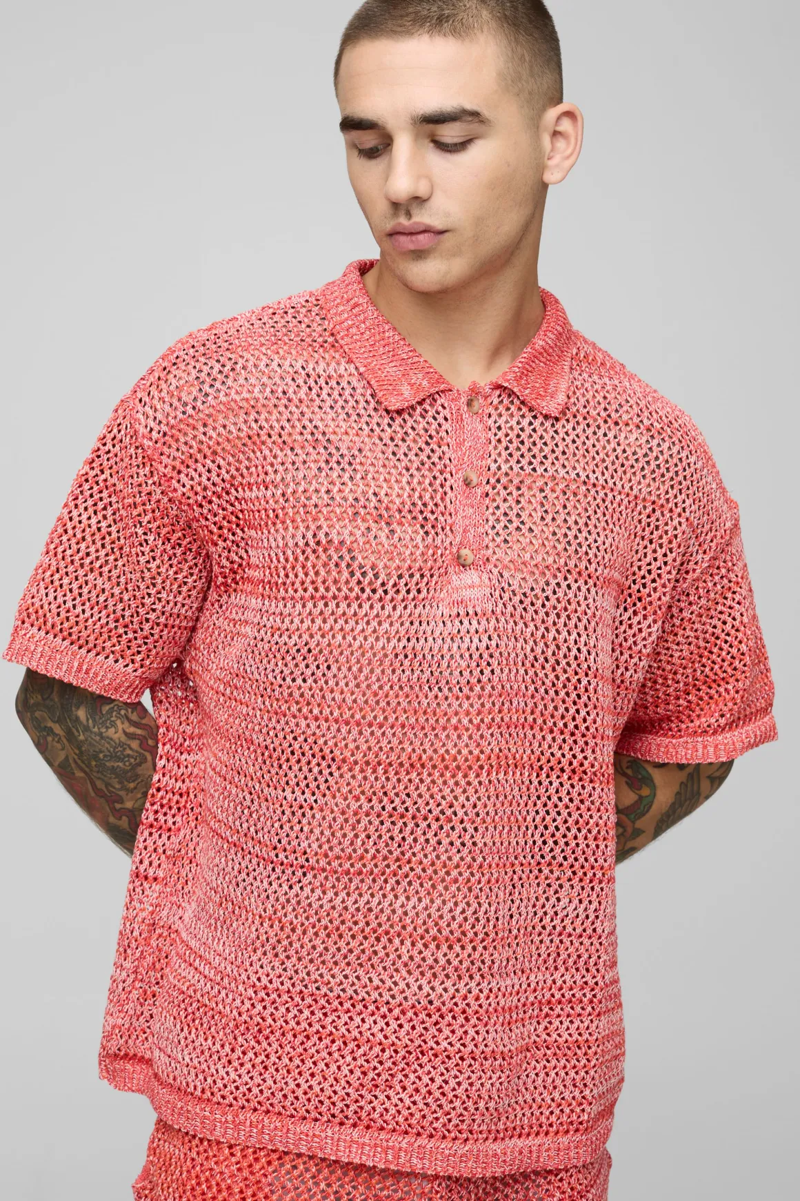 Polo en maille tricotée à col boutonné en fil torsadé surdimensionné