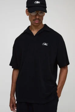 Polo en tissu éponge brodé Revere oversize noir