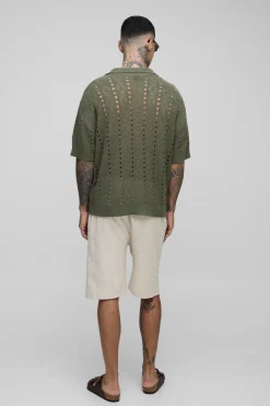 Polo long, boxy, oversize et rayé en maille ouverte