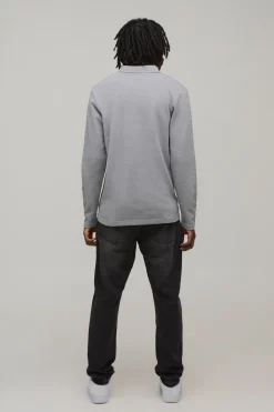 boohooMAN Polo texturé à manches longues, coupe ajustée, signature BM brodée, col en V<Homme Polos