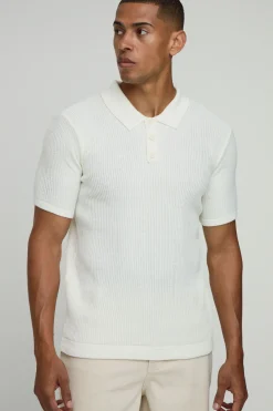 Polo tricoté à motif gaufre, à col boutonné, coupe régulière