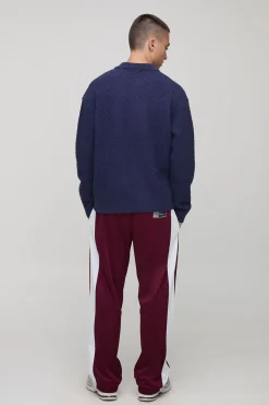 Polo tricoté à panneau brodé surdimensionné