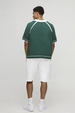 Polo tricoté raglan varsity, col en V et coupe boxy