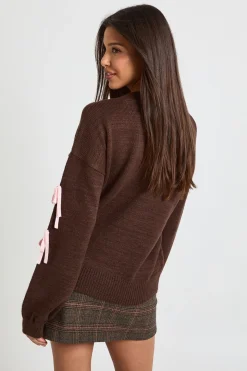 Pull de Noël à nœud féminin