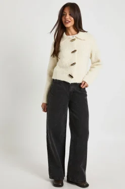 Pull en maille bouclé épais avec col à boutons à bascule