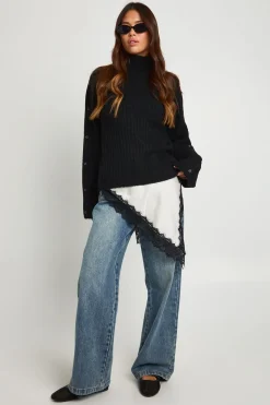 Pull en maille super douce avec détails de manches à bouton et col haut