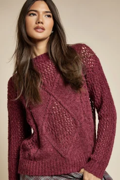Pull surdimensionné tricoté avec un détail en torsades