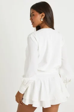 Robe chemise à ourlet tombant avec garniture dorée texturée