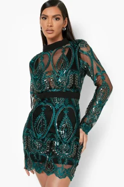 Robe de fête mini en sequins damassé à coupe galbante