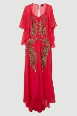 Robe maxi à manches cape tissée ornée de plumes