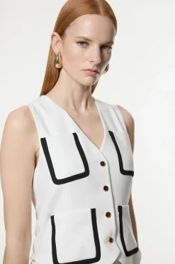 Robe midaxi ajustée sans manches en stretch compact plissée à liseré contrasté.