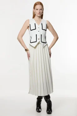 Robe midaxi ajustée sans manches en stretch compact plissée à liseré contrasté.