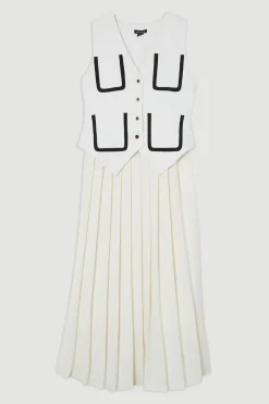 Robe midaxi ajustée sans manches en stretch compact plissée à liseré contrasté.