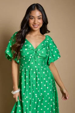 Robe Midi Petite À Pois Avec Détail Torsadé Devant Et Manches Bouffantes
