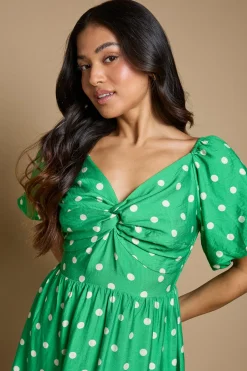 Robe Midi Petite À Pois Avec Détail Torsadé Devant Et Manches Bouffantes
