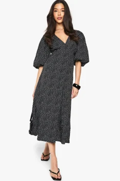 Robe midi à pois avec manches bouffantes et dos noué