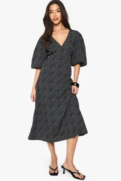 Robe midi à pois avec manches bouffantes et dos noué