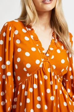 Robe Midi À Pois Orange Avec Couture Empire Et Détails À Volants