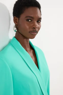 Robe mini blazer ajustée à double boutonnage avec détail cinché