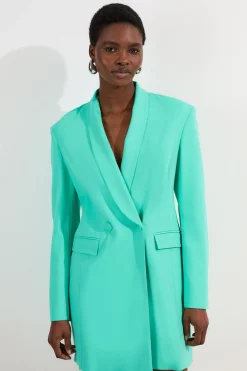 Robe mini blazer ajustée à double boutonnage avec détail cinché