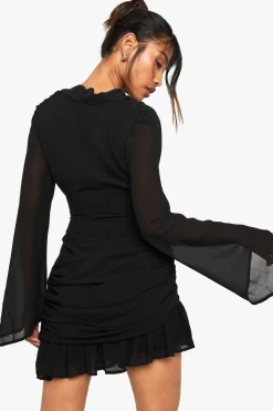 Robe mini à manches longues col drapé