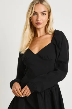Robe mini à manches longues style laitière à volants