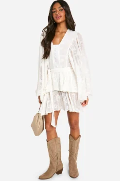 Robe patineuse à étages en jacquard floral ceinturée