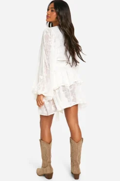 Robe patineuse à étages en jacquard floral ceinturée