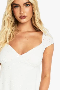 Robe smock en broderie anglaise à manches cap