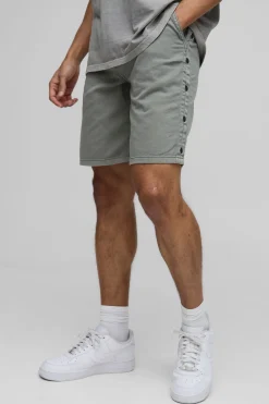 Short à coupe décontractée en sergé surteinté, ourlet boutonné
