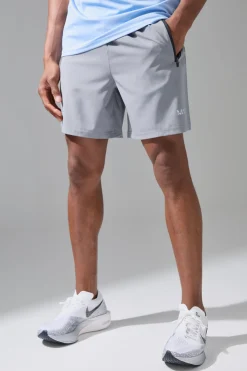 Short de gym homme extensible en tissu tissé, coupe régulière, longueur 7 pouces