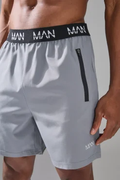 Short de gym homme extensible en tissu tissé, coupe régulière, longueur 7 pouces