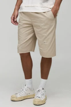 Shorts ample à la coupe décontractée, distressed, à ourlet brut